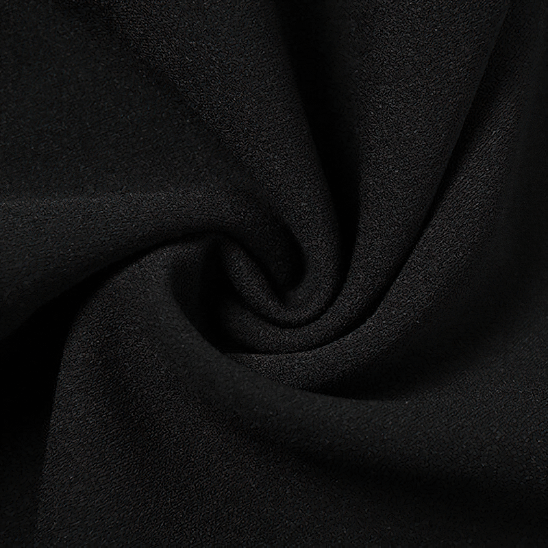 Close-up of soft black fabric, perfect for women's high-waisted flare trousers and aesthetic outfits.