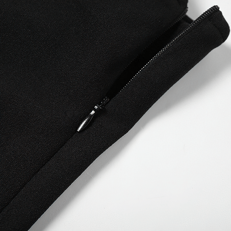 Close-up of the zipper detail on women's black high-waisted flare pants, showcasing stylish aesthetic design.