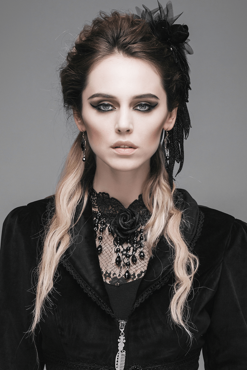 Elegant woman in gothic attire featuring a black lace necklace with a rose, accentuating a stylish and mysterious look.