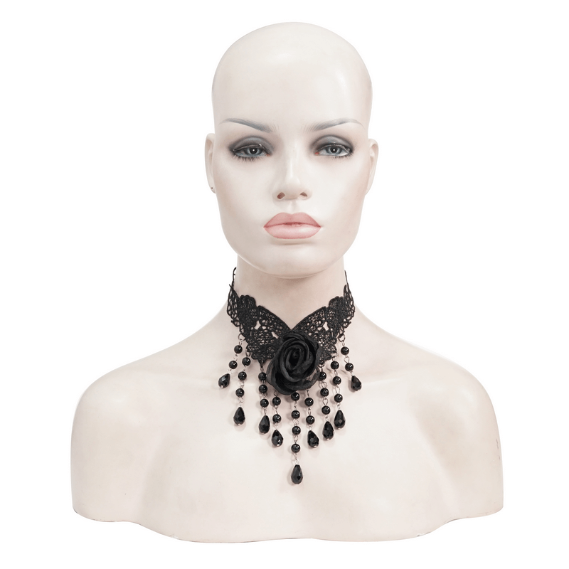 Stylish women's black lace necklace with rose accent and dangling beads, perfect for gothic elegance.