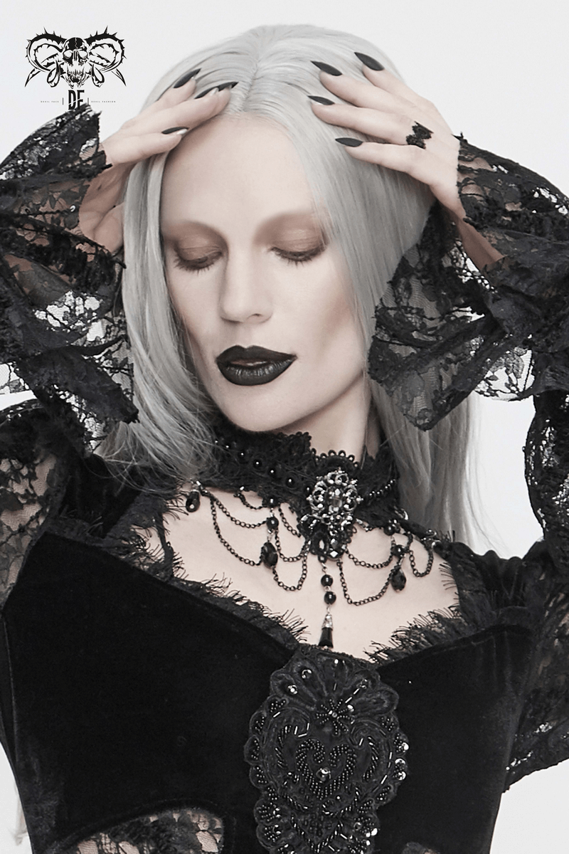 Elegant woman in black lace gothic necklace with rhinestones, showcasing a striking gothic look.