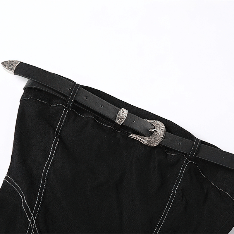 Close-up of a black tube dress with chest belt, featuring stylish silver buckle detailing.