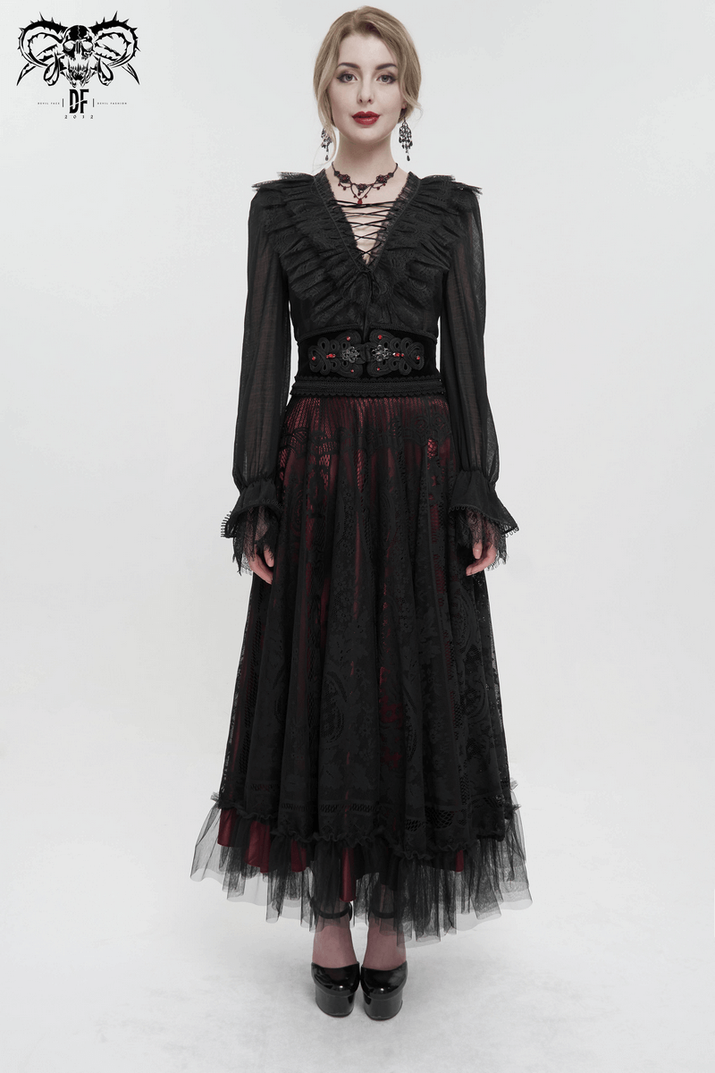 Elegant woman in gothic black dress with lace trim and beaded belt, showcasing vintage style and dark romantic vibe.