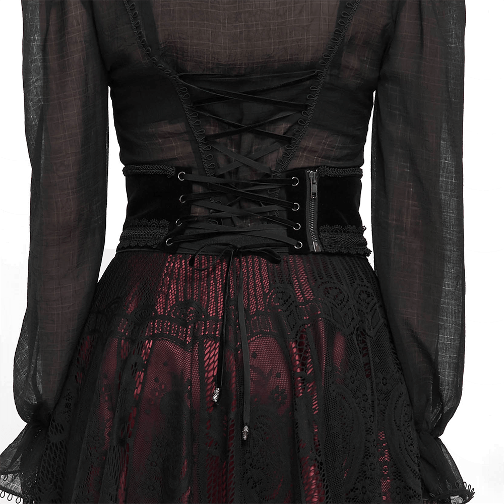 Back view of a women's black vintage lace girdle with corset lacing, paired with a gothic style dress.