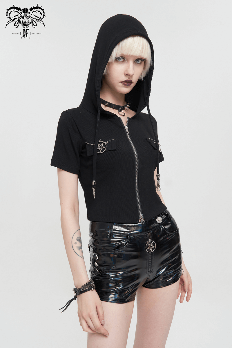 Stylish woman in a black zipper hooded top with pentagrams, showcasing alternative gothic fashion.