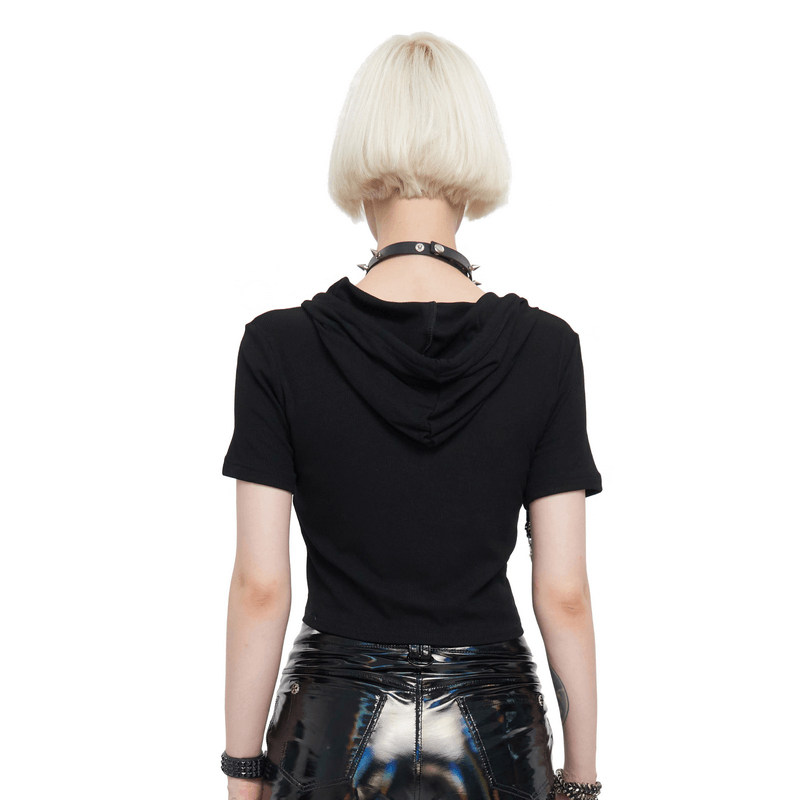 Back view of a stylish woman in a black hooded top, showcasing alternative gothic fashion with a chic cropped cut.