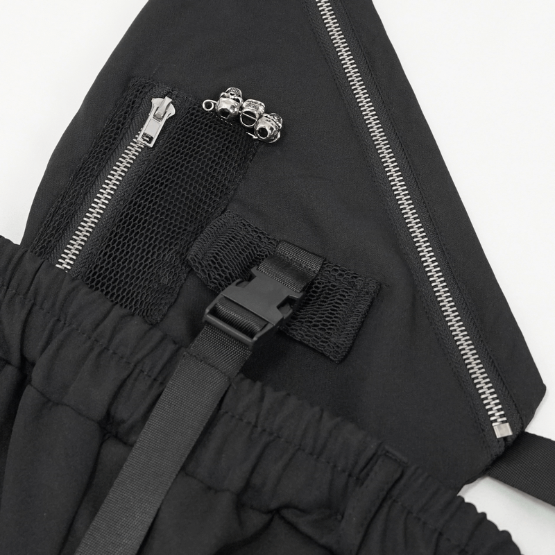 Close-up of women's punk suspender pants featuring zippers, mesh pockets, and skull rivets for a stylish look.