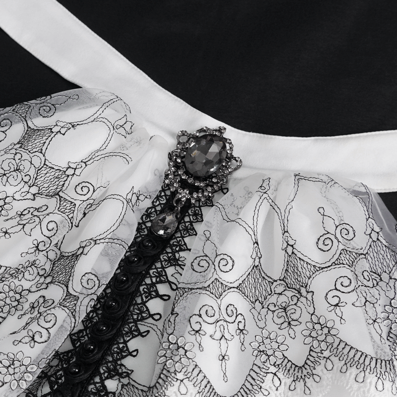 Close-up of women's gothic floral embroidered necktie with ruffled lace and gem detailing in black and white.