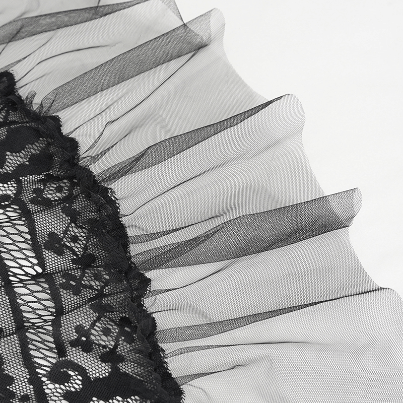 Close-up of layered black lace fabric showcasing elegant ruffles and intricate patterns for a gothic skirt.