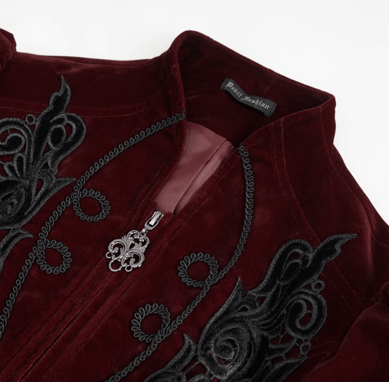 Close-up of a women's wine red gothic velvet jacket featuring lace appliqué and decorative zipper.