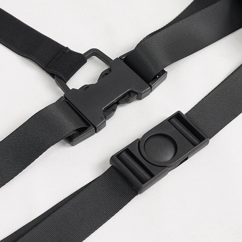 Close-up of black buckle strap harness for grunge-style tops, highlighting adjustable straps and sturdy clips.