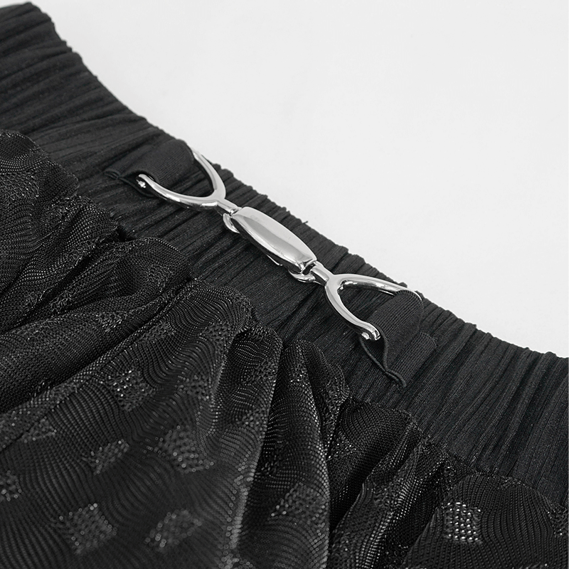 Close-up of the elastic waistband and clasp detail on a women's black irregulary layered mesh skirt.