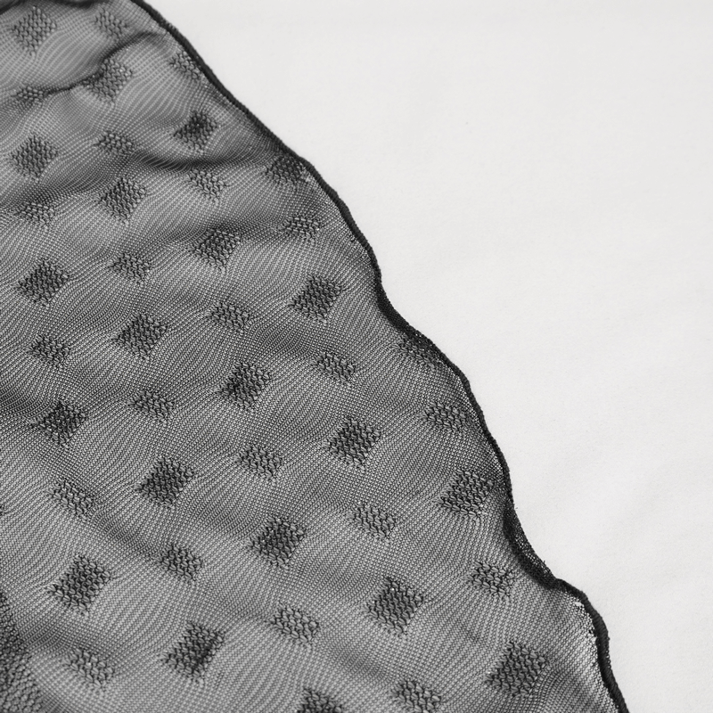 Close-up of black mesh fabric with dotted texture, perfect for a layered grunge style skirt.