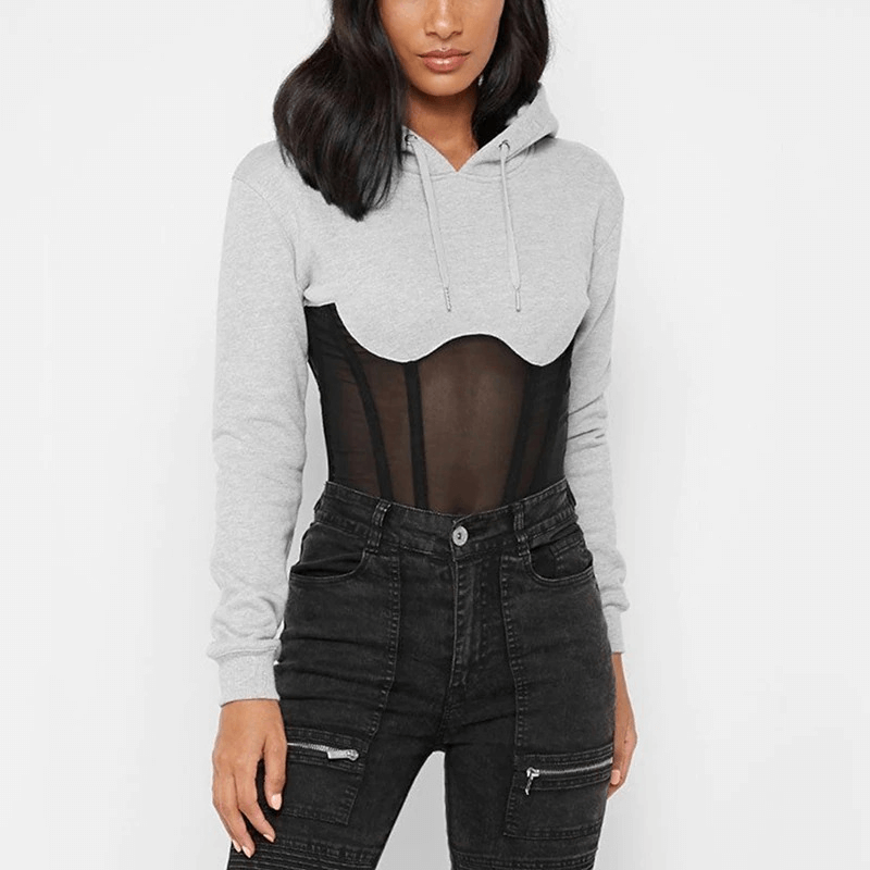 Trendy women's long sleeve hoodie with see-through mesh elements in gray and black, styled casually.