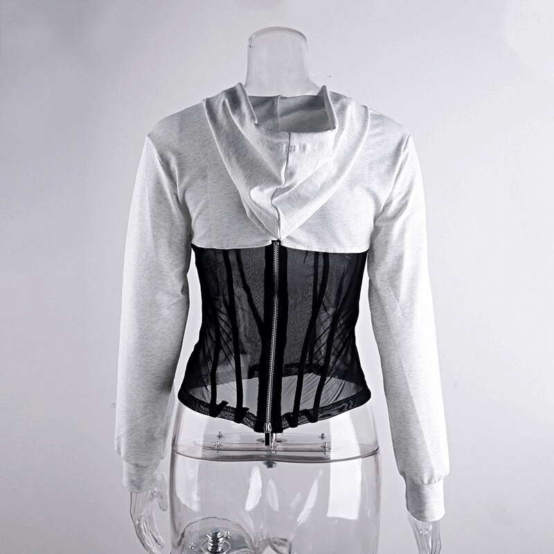 Back view of a trendy women's long sleeve hoodie featuring see-through mesh elements and a stylish zipper.