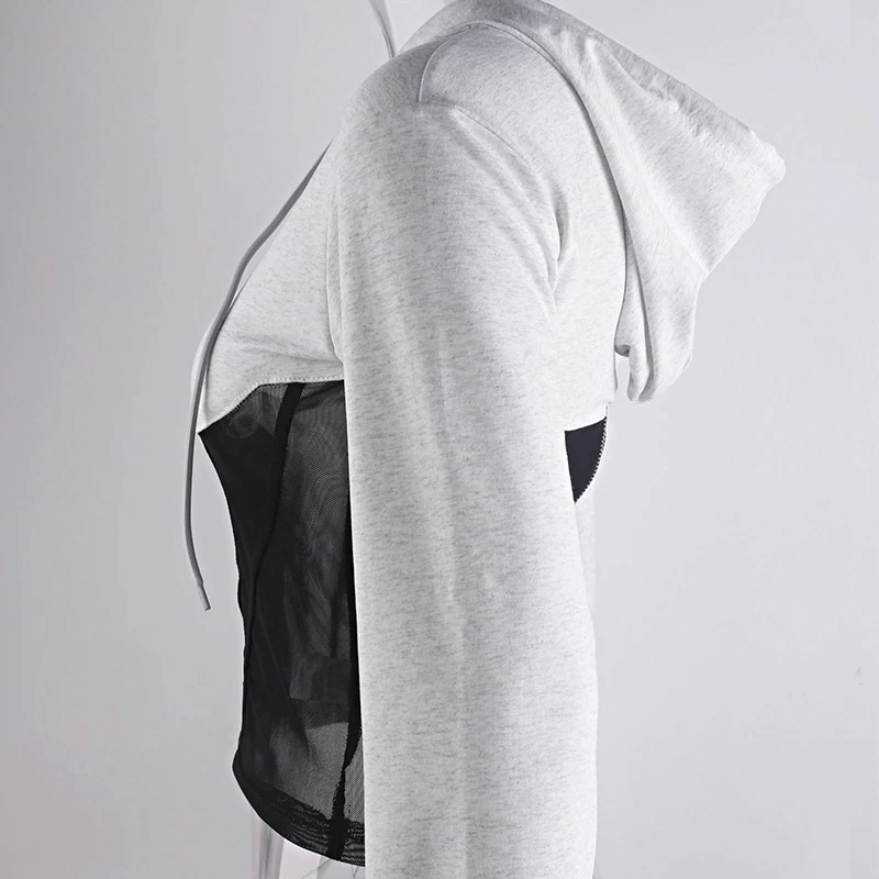 Side view of a women's long sleeve grey hoodie featuring mesh inserts for a trendy casual look.