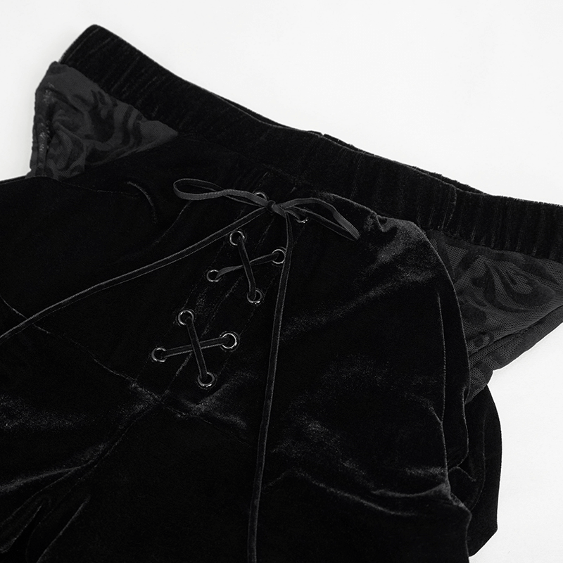Close-up of stylish black flared pants with lace-up design and soft fabric, perfect for gothic fashion.