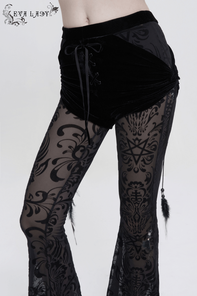 Women's gothic black flared pants with feather pendant, featuring stylish mesh splice design.
