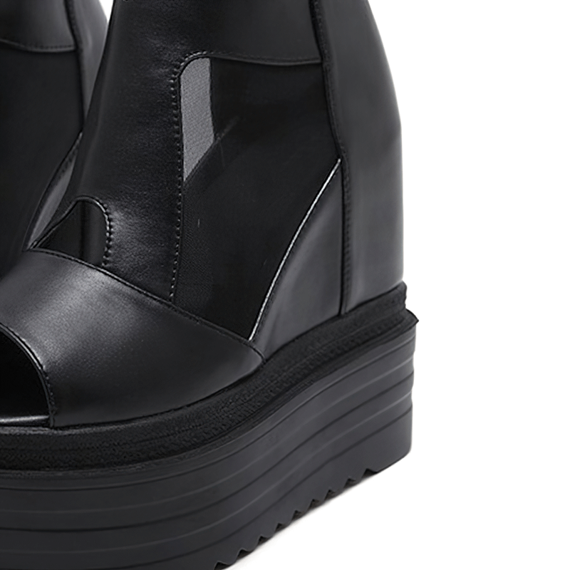 Stylish women's open-toe wedge sandals with breathable black design and trendy platform soles.