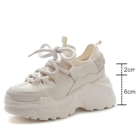 Women's stylish platform sneakers in white, featuring a lace-up design and trendy height-boosting soles.