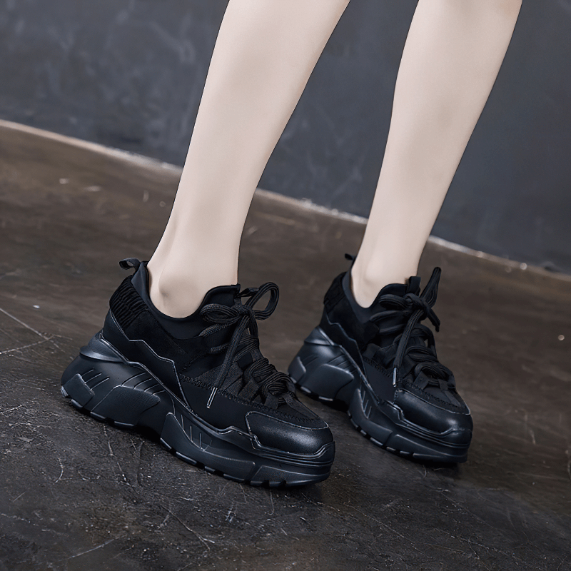 Stylish women's platform genuine leather sneakers in black, featuring a trendy lace-up design and increased insole.