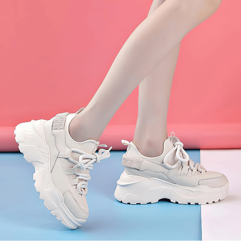 Stylish women's genuine leather platform sneakers with lace-up design and increased insole, perfect for casual wear.