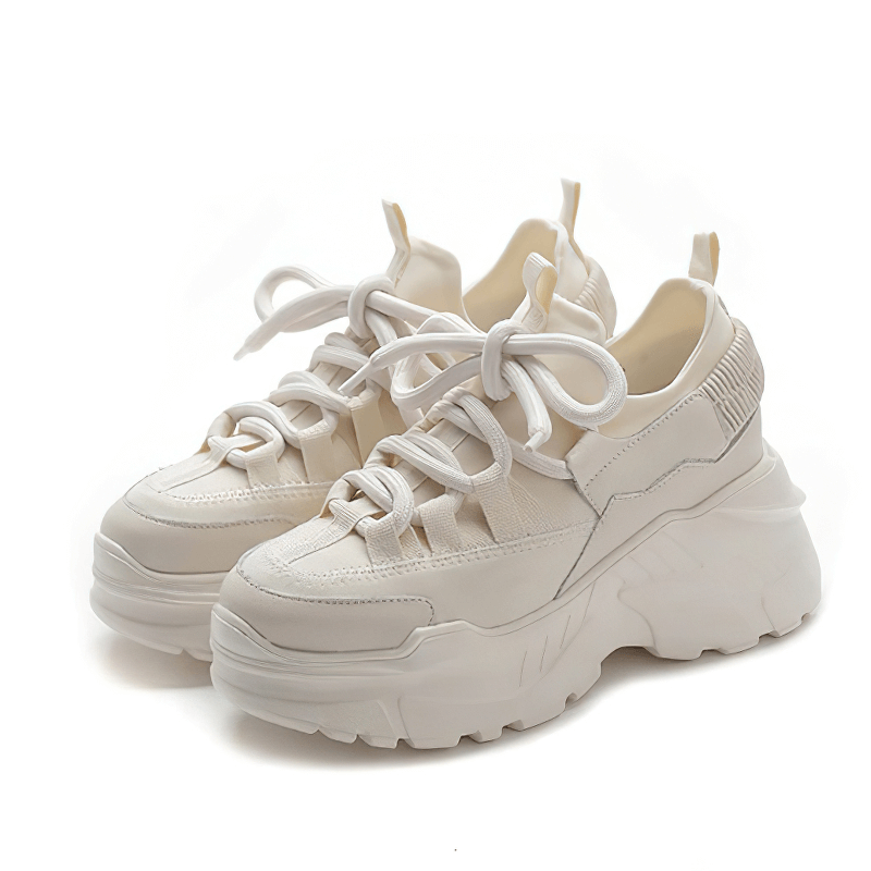 Stylish white women's platform sneakers with lace-up design, perfect for casual outings and trendy looks.