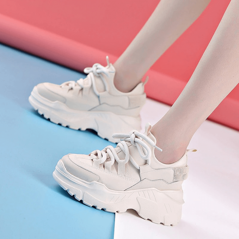 Stylish women's platform genuine leather sneakers in light color, perfect for casual everyday outfits.