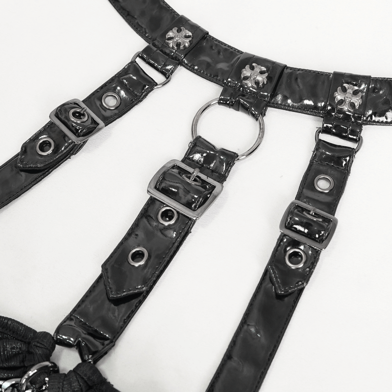 Close-up of gothic lingerie straps with metallic details and buckles, featuring chains for a punk-inspired look.