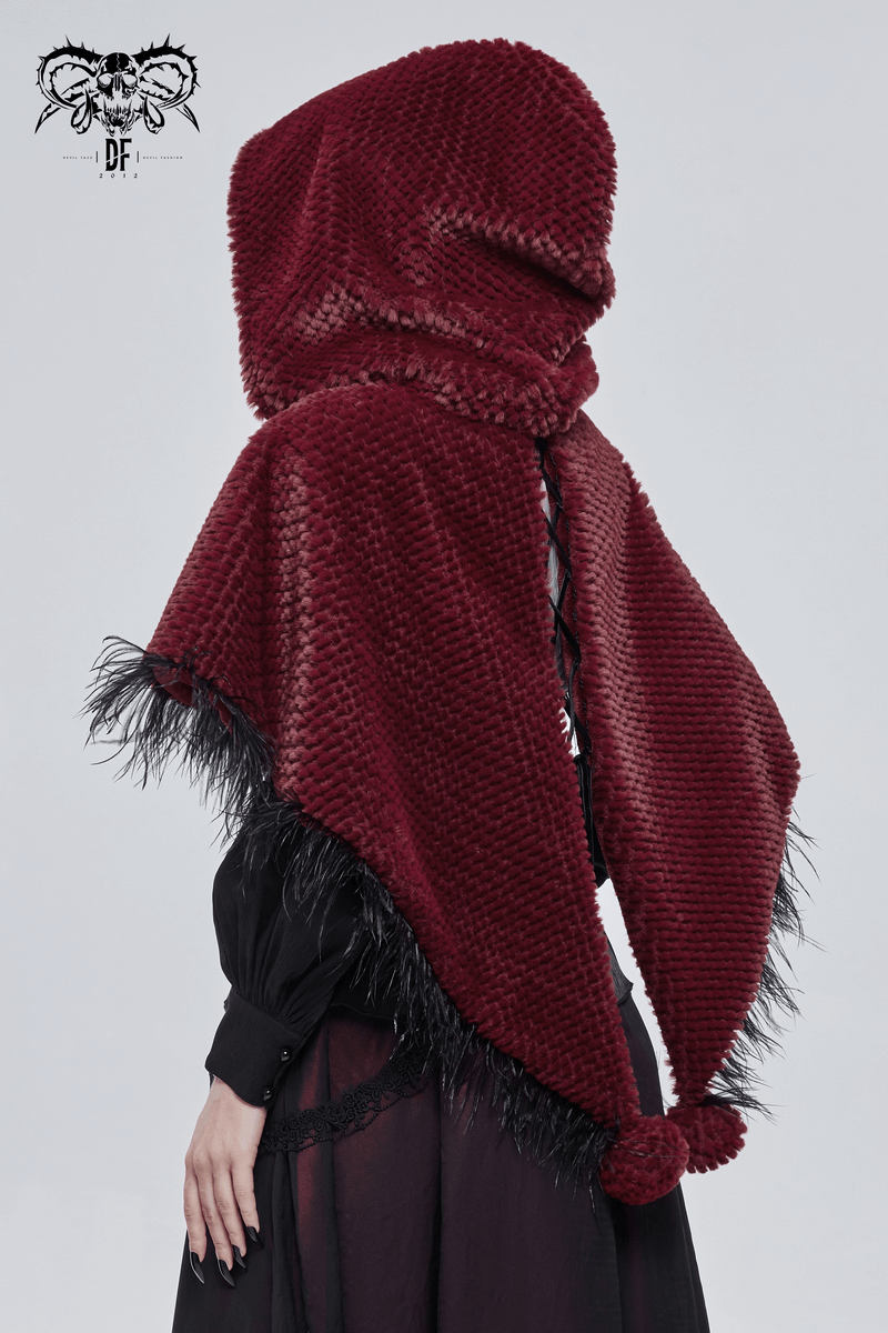 Back view of a women's red hooded cape with fringes and fur balls, showcasing gothic fashion style.