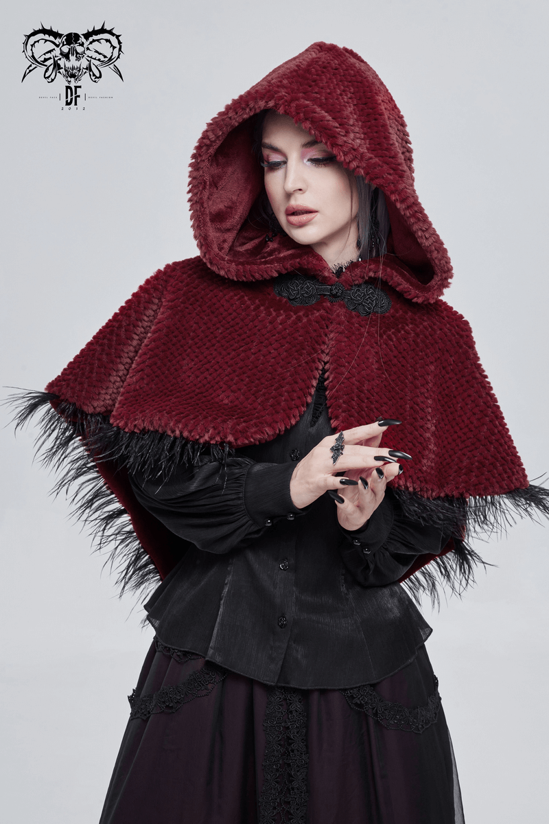 Gothic women's red hooded short cape with fringes, stylishly worn by a model against a neutral background.
