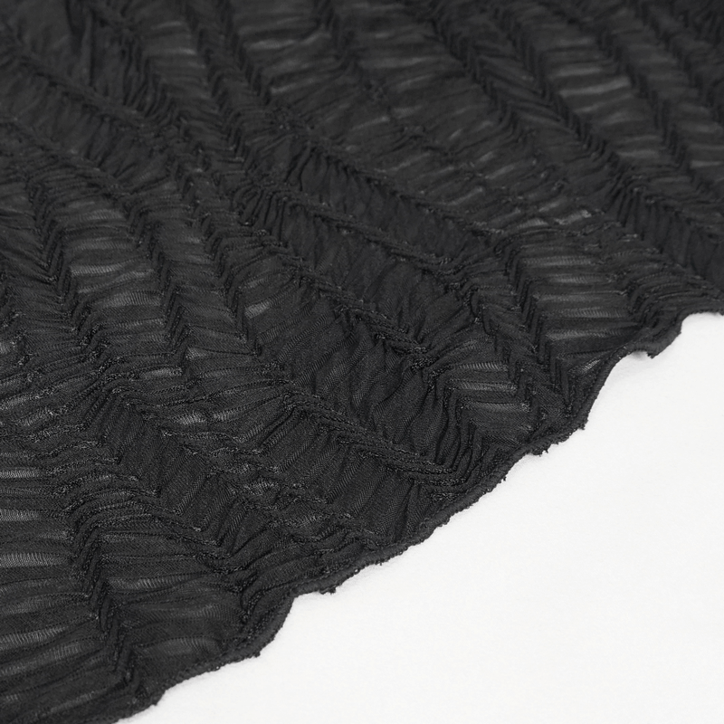 Close-up of black fabric with stylish pleated texture for women's punk fashion.