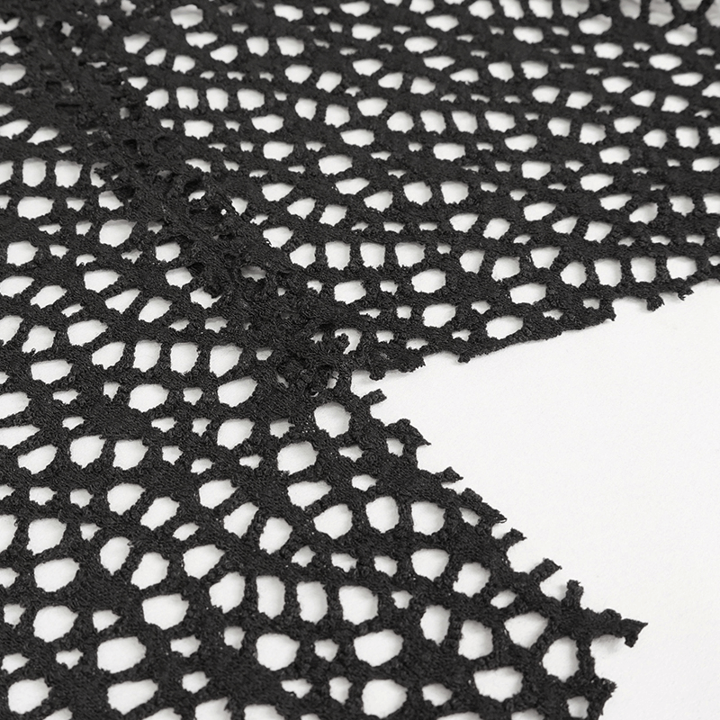 Close-up of black mesh fabric showcasing unique punk-style texture and design for women's fashion.