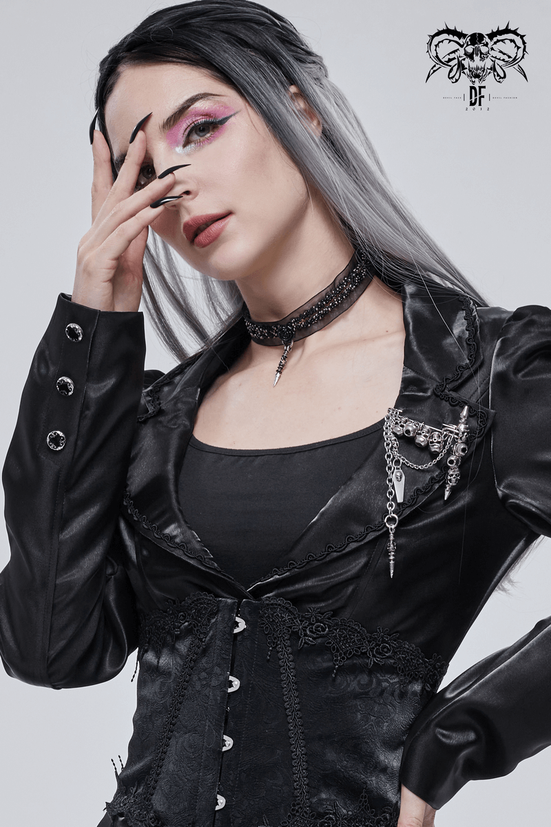 Stylish woman in gothic fashion with a skull chain brooch, highlighting edgy alternative accessories.