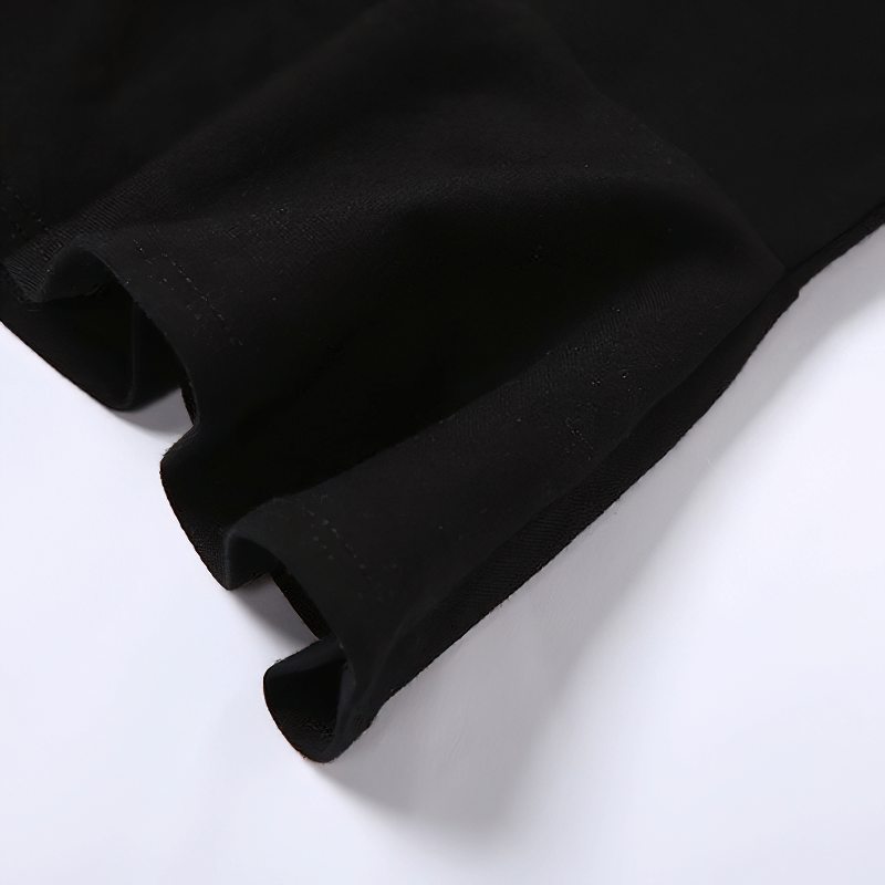 Close-up of the hem and sleeve of a women's black A-line dress, showcasing high-quality fabric and casual design.