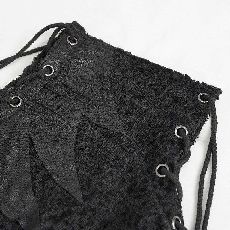 Close-up of women's gothic ripped sweatshirt detailing with lace-up design and edgy texture.