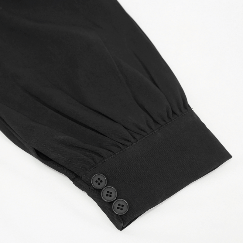 Detail of black women's jogger pants showing elastic cuff and button closure for a trendy punk style.