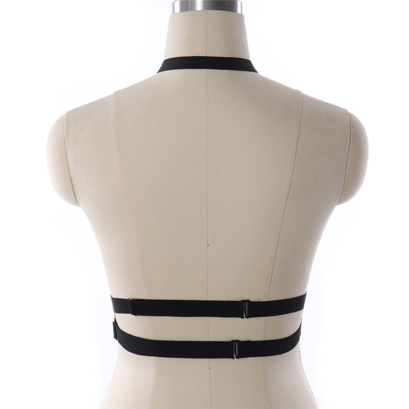 Back view of women's sexy pentagram bondage harness on mannequin, gothic spandex belt, adjustable for cosplay and lingerie looks.