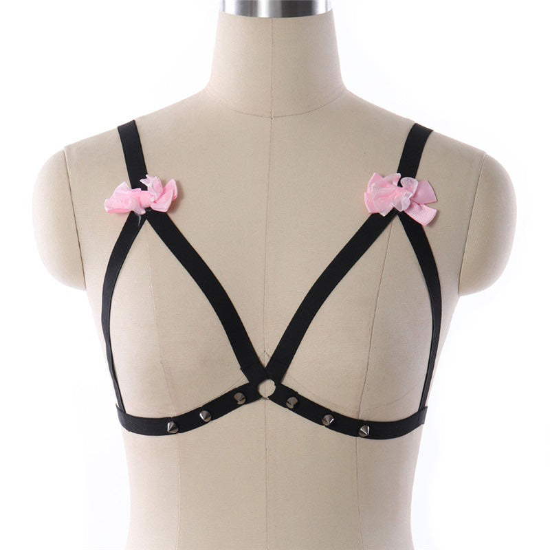 Women's sexy black body harness with pink bows and studs, perfect for bondage and cosplay.