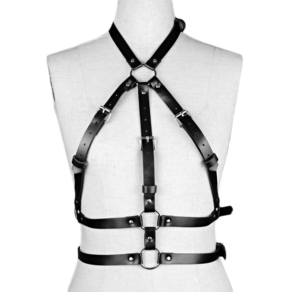 Black leather body harness with silver fittings for gothic role play and dance, stylish accessory for intimate and club settings.