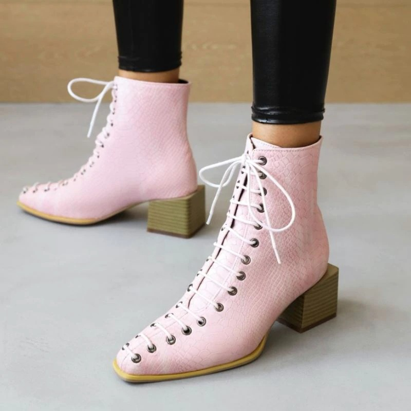 Stylish women's pink lace-up ankle boots with thick heels, perfect for a fashionable look and available in mixed colors.
