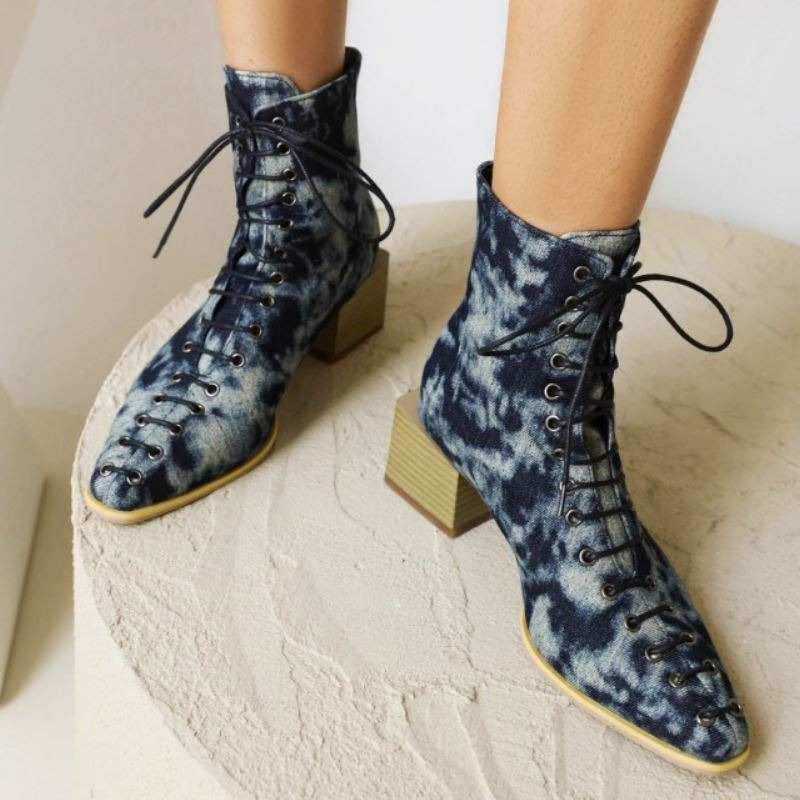 Stylish mixed color ankle boots for women with thick heels and lace-up detail, perfect for trendy looks.
