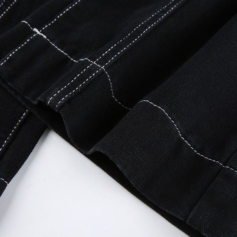Close-up of high waist black trousers showing detailed stitching and fabric texture, ideal for gothic or rave outfits.