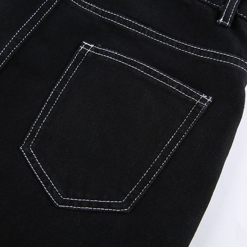 Close-up of black yoga pants back pocket with white stitching, perfect for gothic and rave outfits.