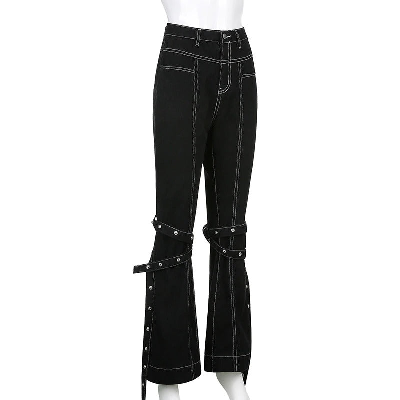 High waist black rivet trousers with zip details and straps, perfect for a stylish rock or goth look.