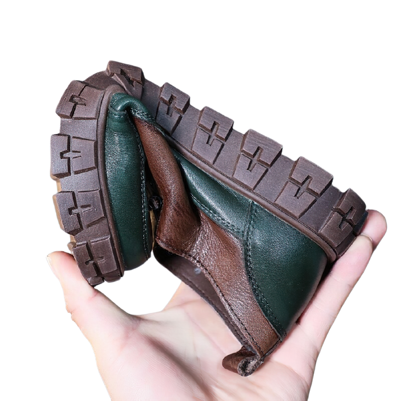 Women’s casual leather sneakers showing flexible design and stylish platform sole in green and brown.