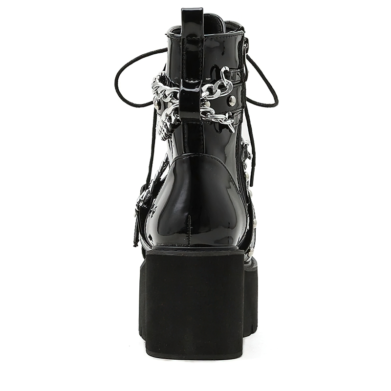 Stylish black women's boots with chain and rivets, featuring a square heel and trendy rock style.