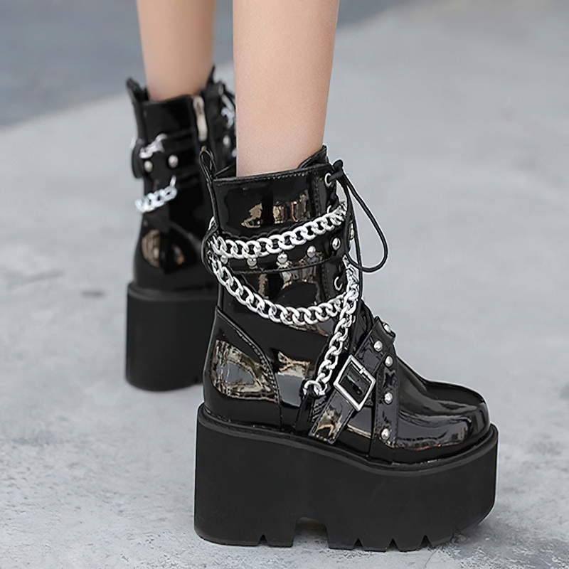 Stylish women's black PU leather boots with chains and rivets, featuring a high platform sole and rock style.