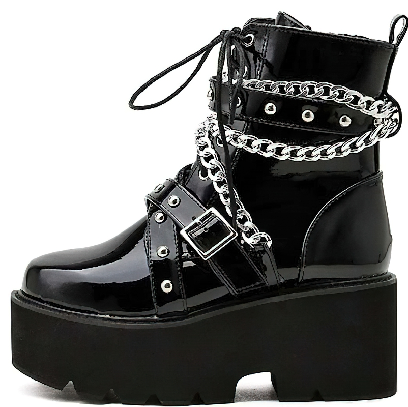 Women stylish black boots with chain and rivets, featuring high platform soles for a trendy rock look.