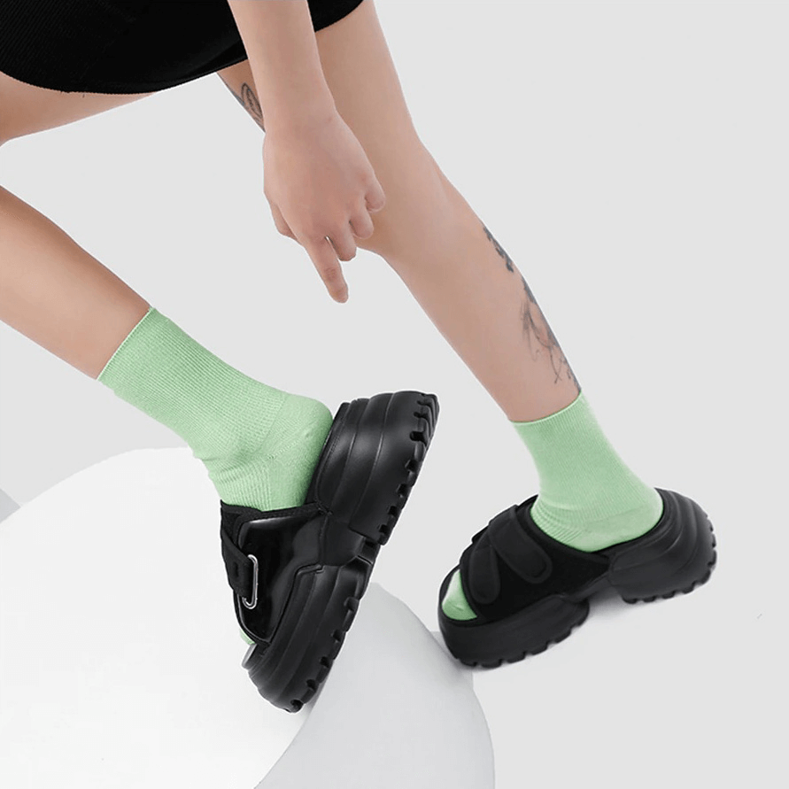 Stylish women's thick platform slippers with green socks, perfect for summer beach outings or casual lounging.